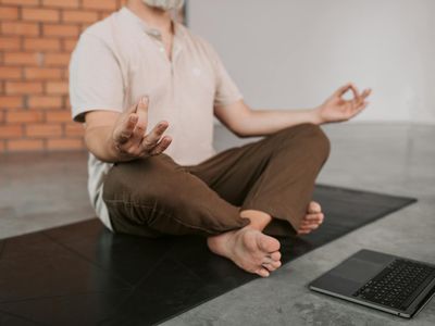 Calm person meditating after exercise session.