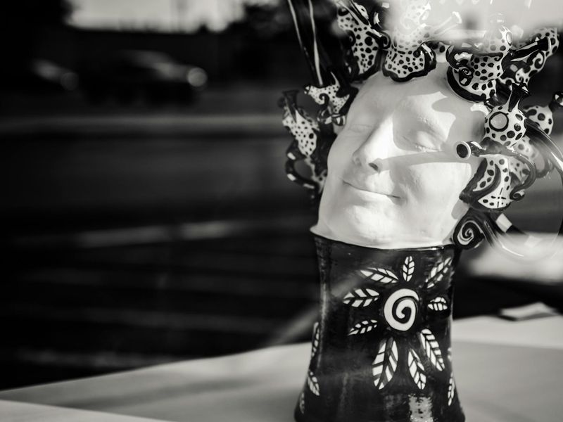 Minimalist fitness studio with sunlight through windows.